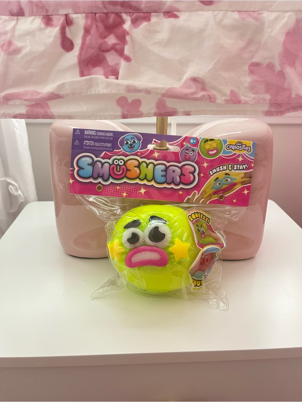 Smushers Neon Yellow Emoji Squisher Toy with Pink Mouth and Black Brows